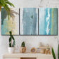 Three-panel canvas wall art featuring abstract coastal shoreline textures, displayed in a boho-chic entryway above a console table.