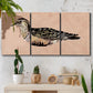 Three-panel canvas wall art featuring coastal bird illustration, displayed in a boho-chic entryway above a console table.