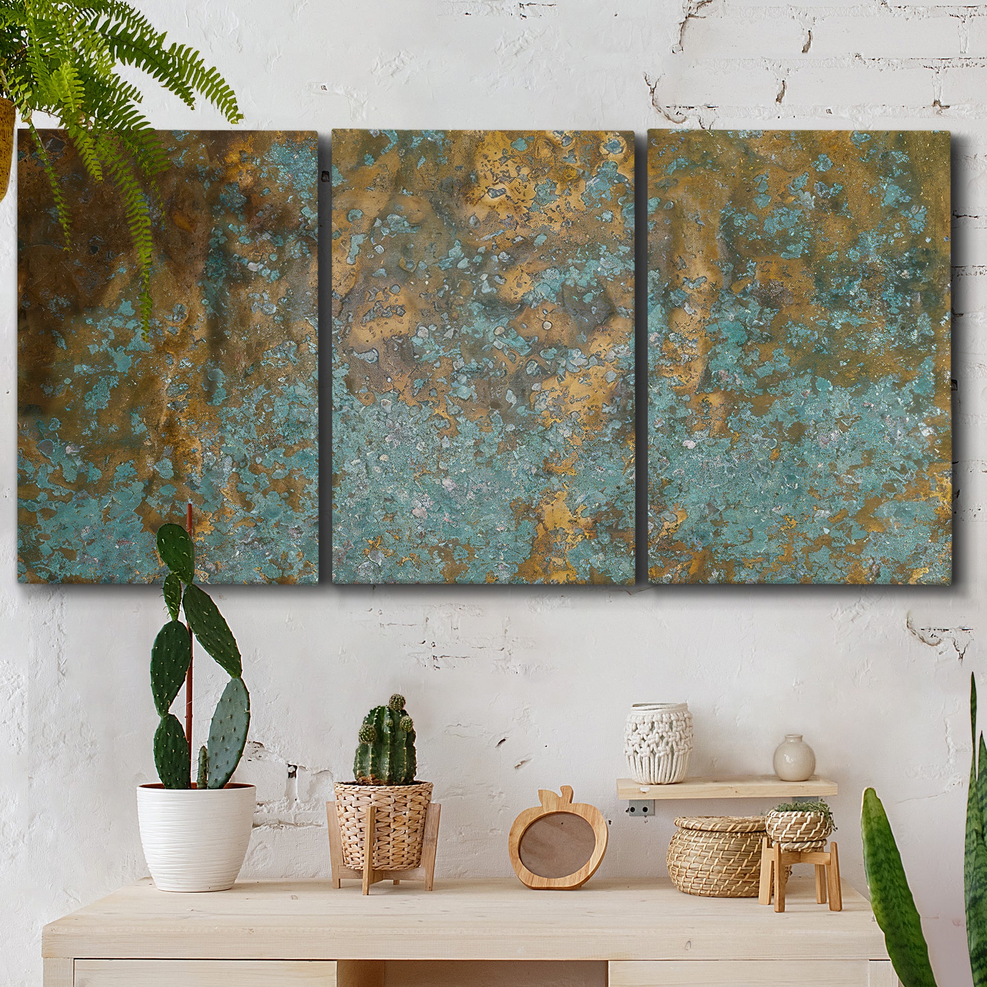 Three-panel canvas wall art featuring earthy copper toned abstract, displayed in a boho-chic entryway above a console table.