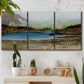 Three-panel canvas wall art featuring peaceful lakeside shoreline landscape, displayed in a boho-chic entryway above a console table.