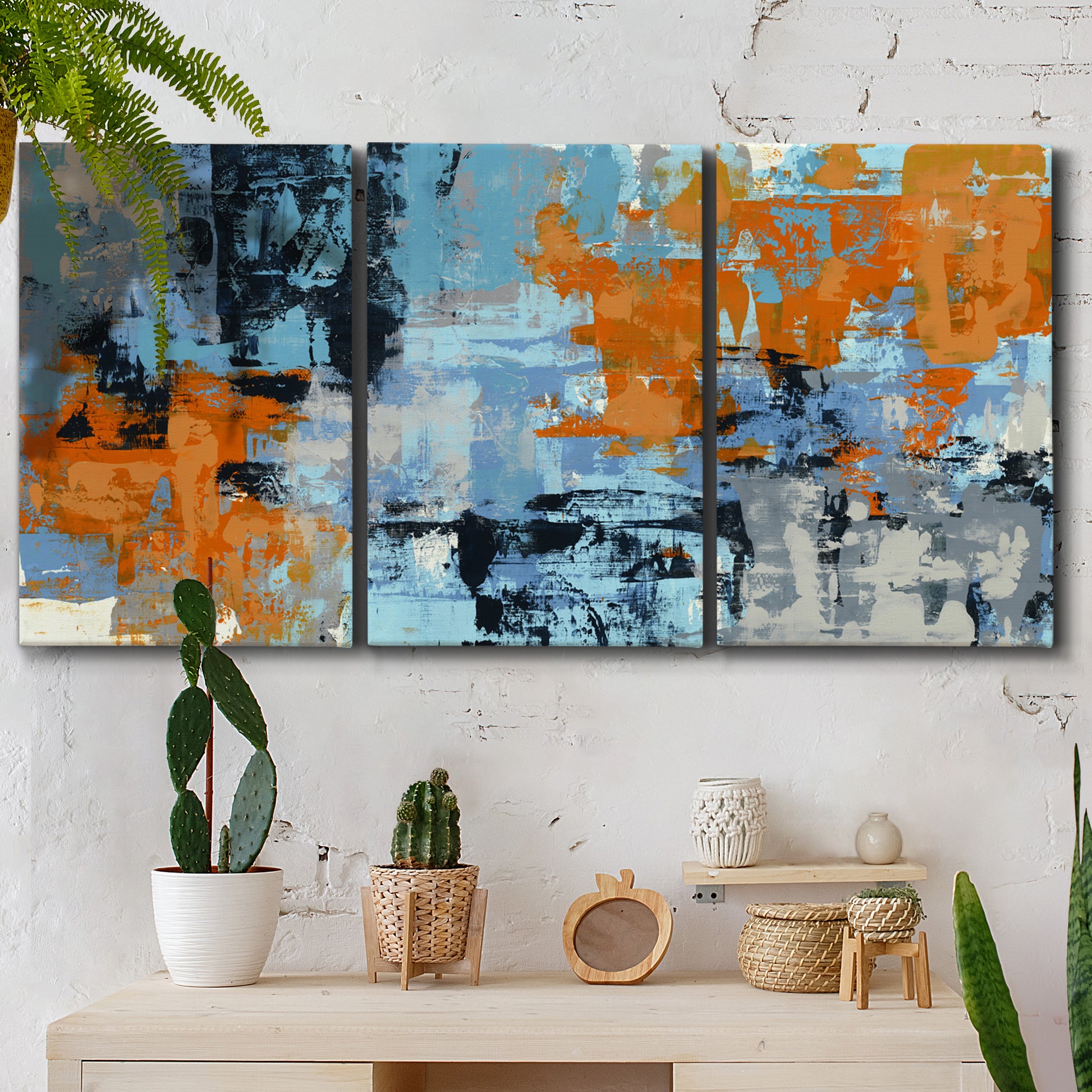 Three-panel canvas wall art featuring mid century abstract playground shapes, displayed in a boho-chic entryway above a console table.