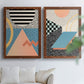 Set of two maple barnwood framed canvas prints depicting checkerboards stripes squiggles peach blue black and mint shapes arranged across two complementary compositions above a sofa in a bright living space.