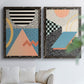 Set of two black barnwood framed canvas prints depicting checkerboards stripes squiggles peach blue black and mint shapes arranged across two complementary compositions above a sofa in a bright living space.