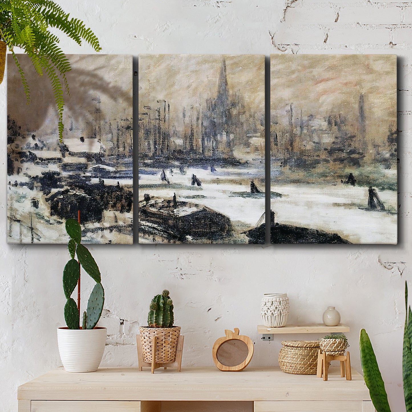 Three-panel canvas wall art featuring snowy village road in winter, displayed in a boho-chic entryway above a console table.