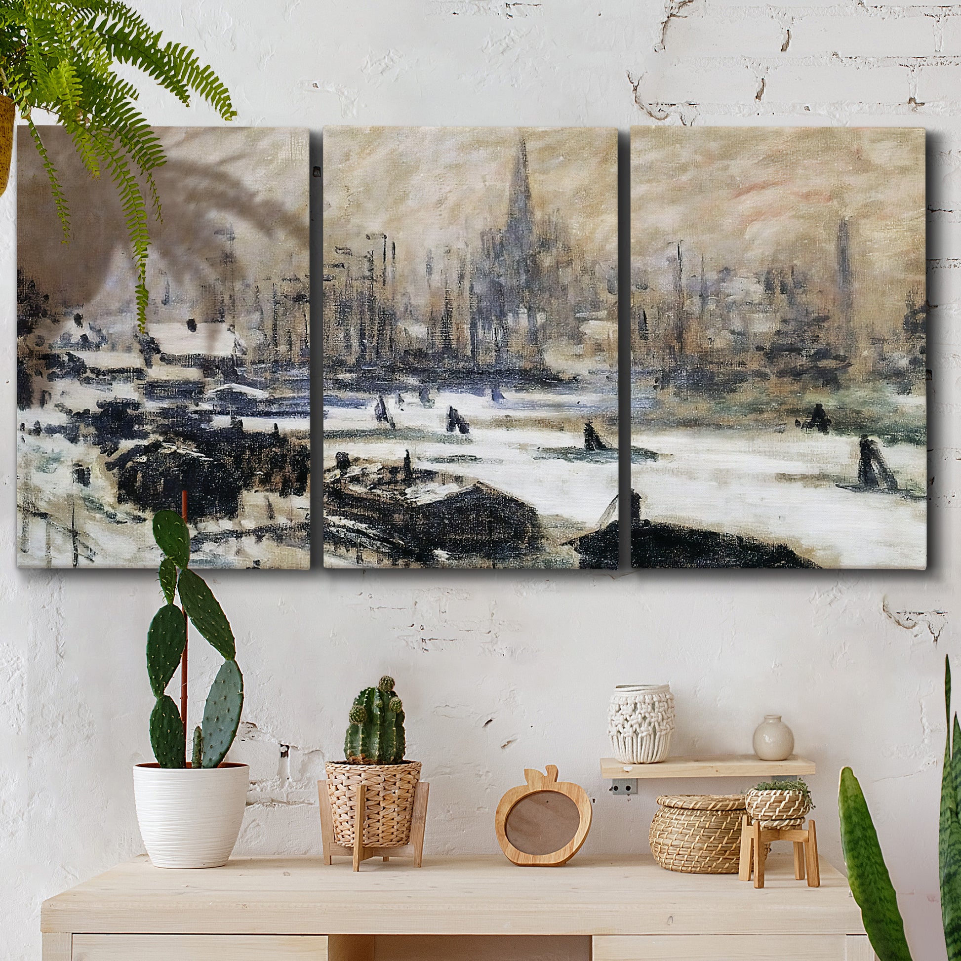 Three-panel canvas wall art featuring snowy village road in winter, displayed in a boho-chic entryway above a console table.