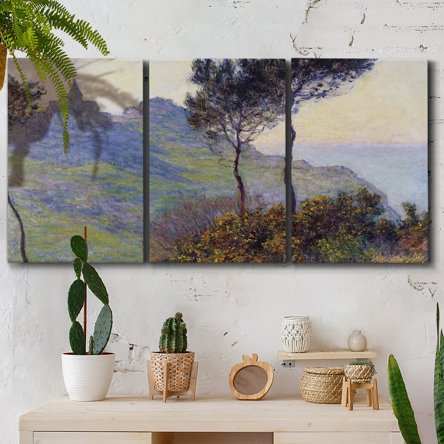 Three-panel canvas wall art featuring village church at sunset, displayed in a boho-chic entryway above a console table.