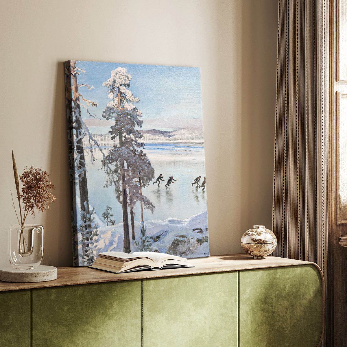 Canvas art print of a peaceful winter landscape with skaters on ice beside a forest shoreline styled in a home decor setting.
