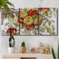 Three-panel canvas wall art featuring apples hanging from branch, displayed in a boho-chic entryway above a console table.