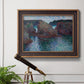 Impressionist rocky seascape by Claude Monet in an ornate bronzed mahogany wood frame displayed in a light-toned interior setting.