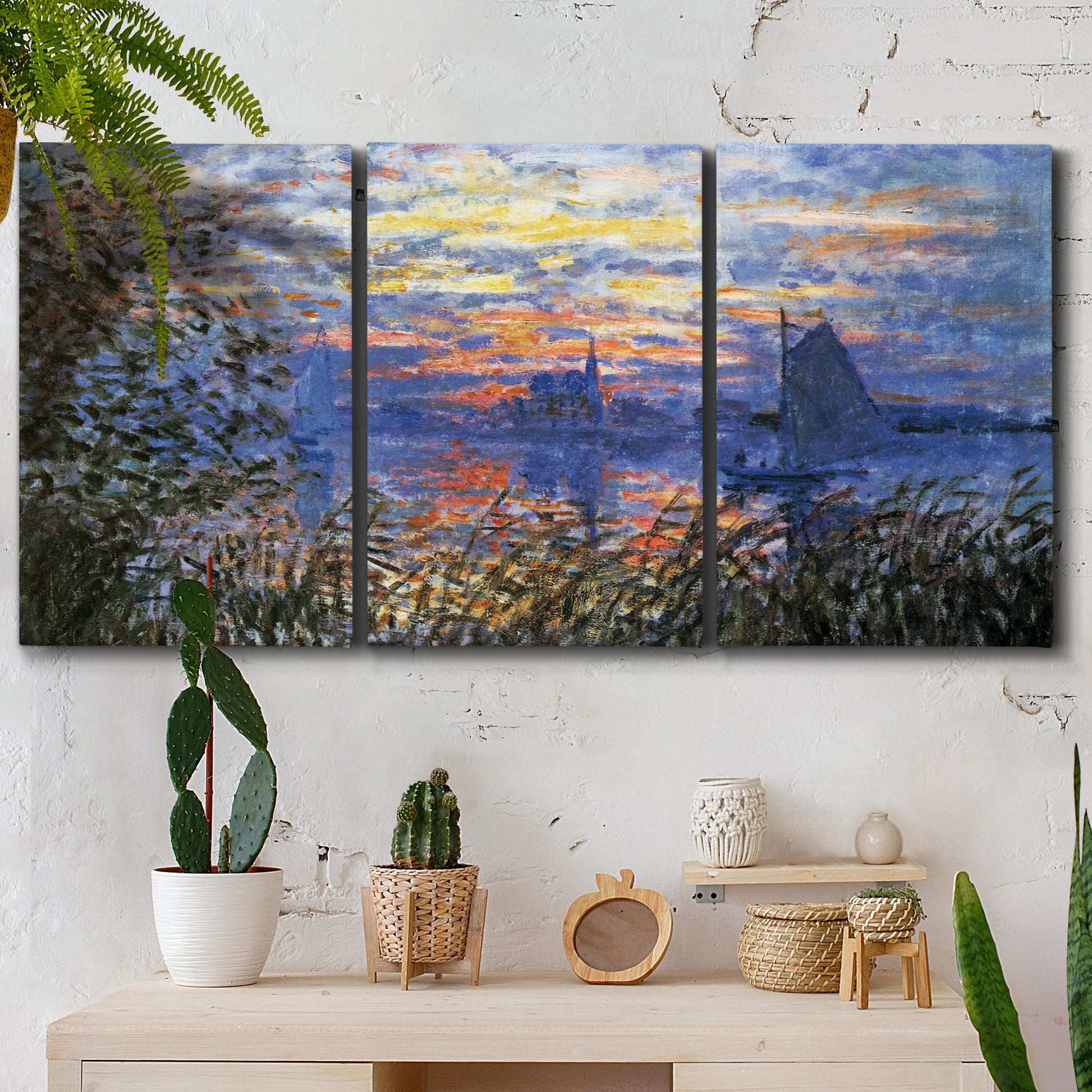 Three-panel canvas wall art featuring river sunset with reflections, displayed in a boho-chic entryway above a console table.
