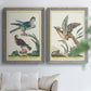 Set of two gray barnwood framed canvas prints depicting soft clustered strokes, hazy edges, and spacious white fields arranged across two complementary compositions above a sofa in a bright living space.