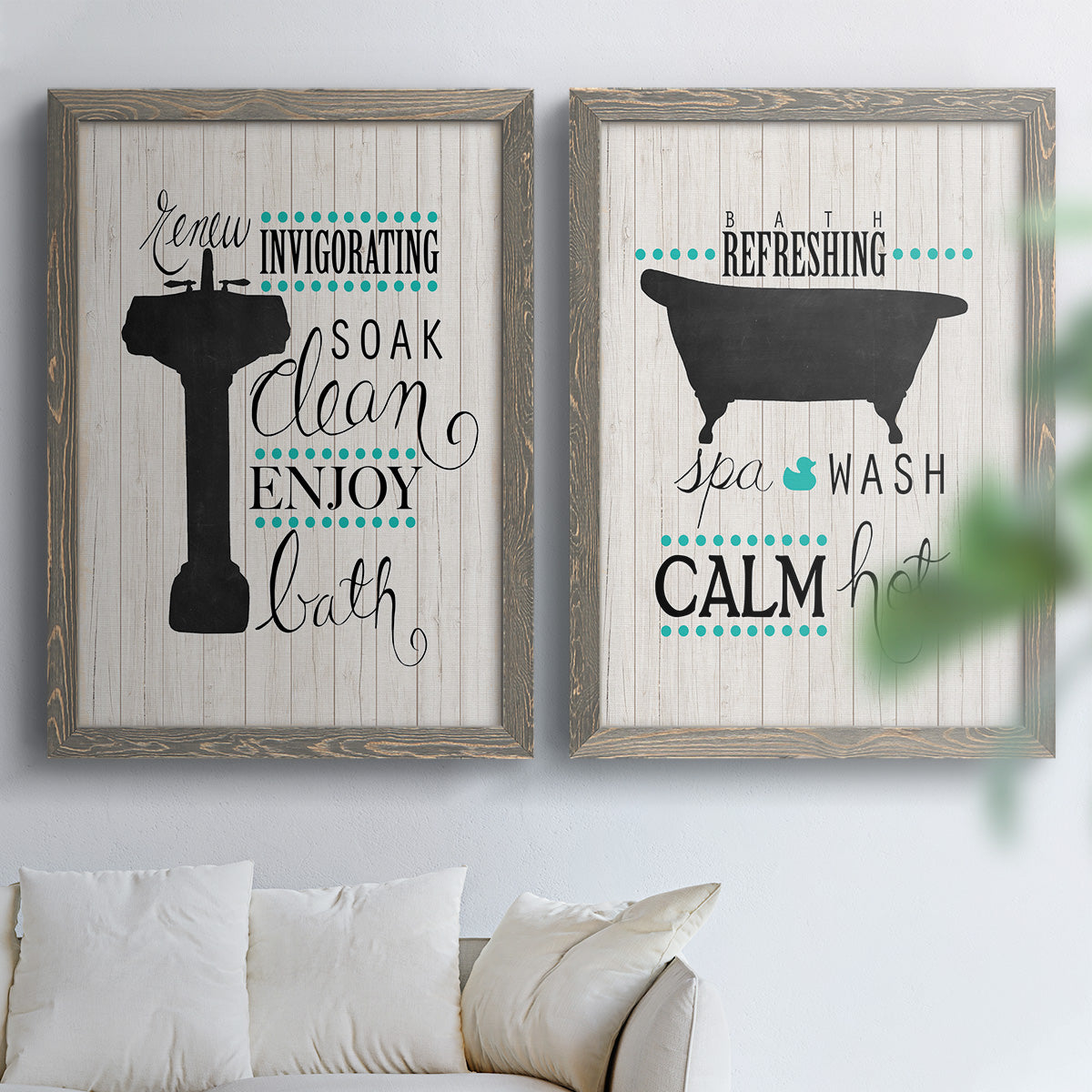 Set of two gray barnwood framed canvas prints depicting black tubs, hand-lettered phrases, and small teal accents arranged across two complementary compositions above a sofa in a bright living space.