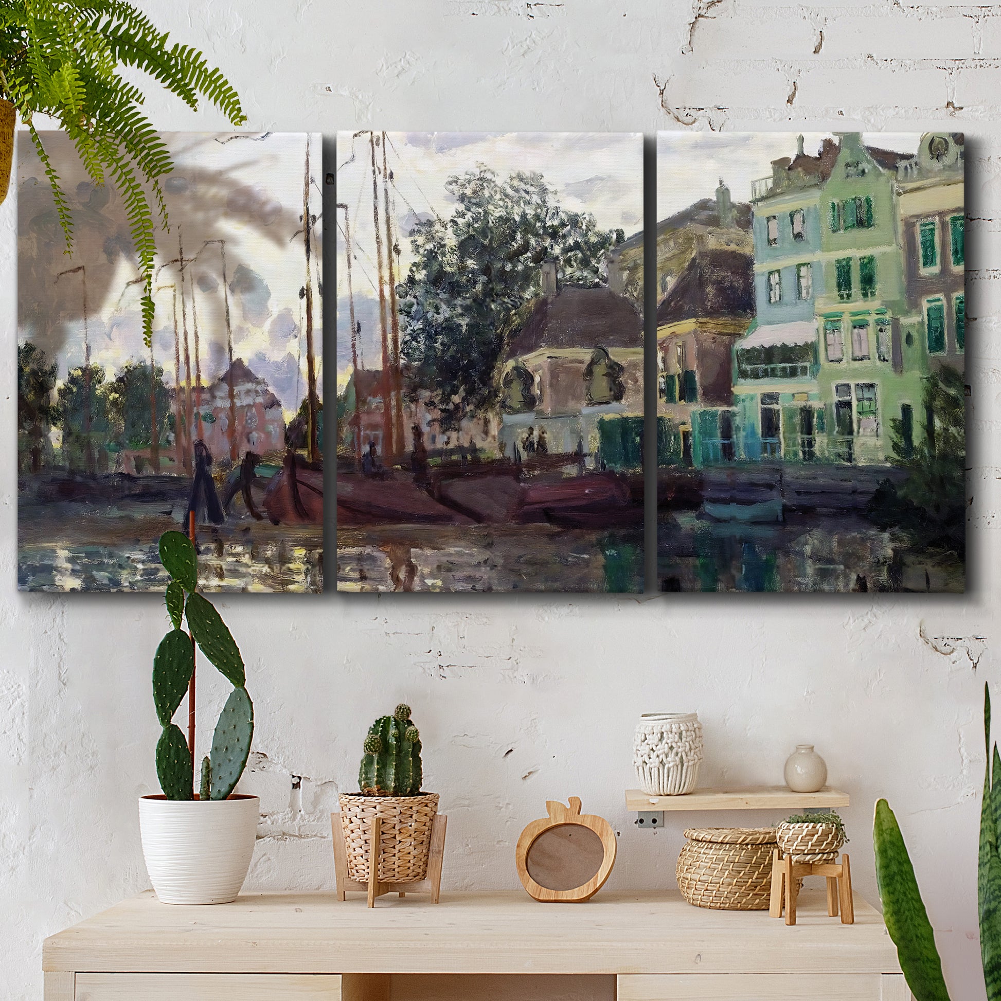 Three-panel canvas wall art featuring riverside town dike at evening, displayed in a boho-chic entryway above a console table.