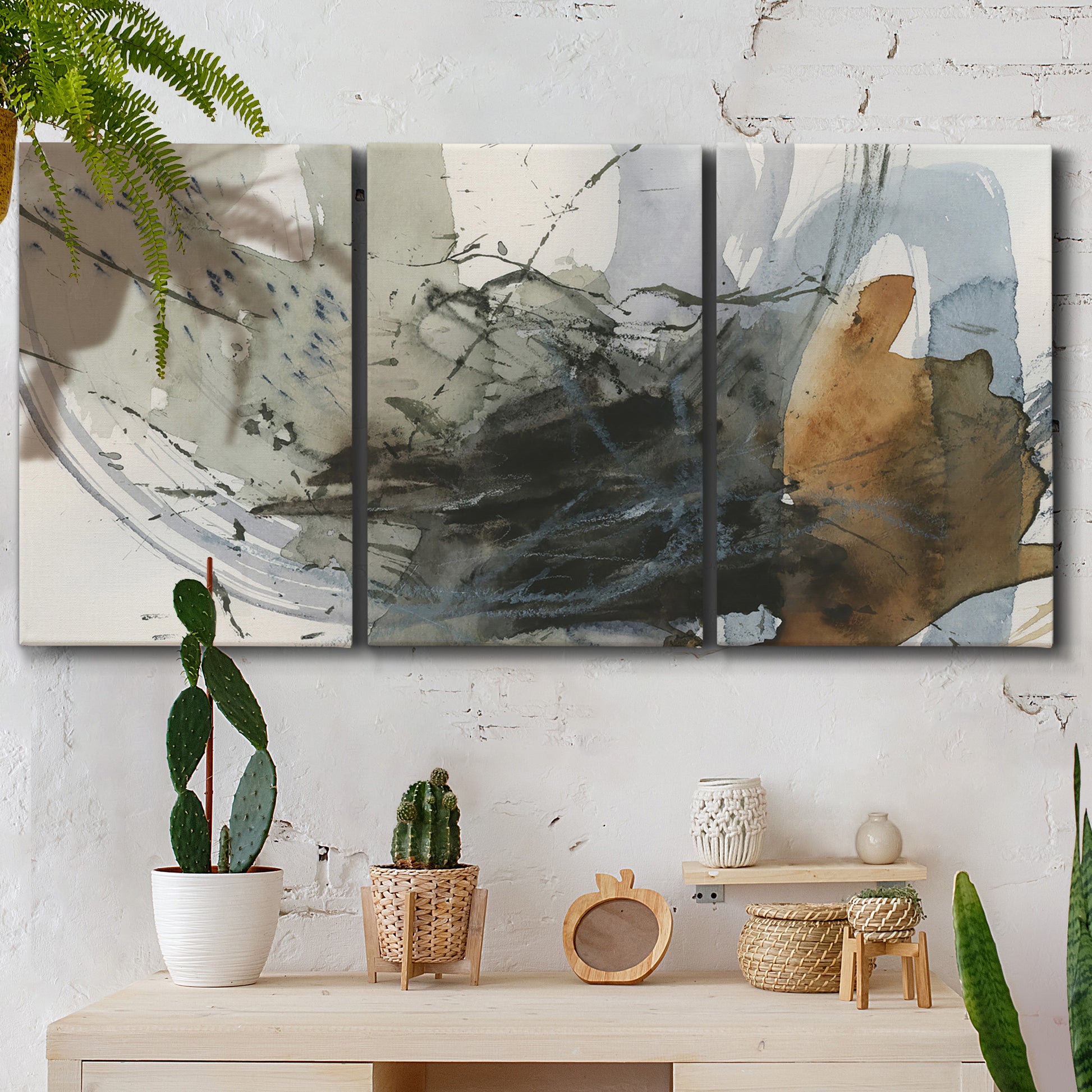 Three-panel canvas wall art featuring dynamic circular abstract motion, displayed in a boho-chic entryway above a console table.