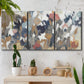 Three-panel canvas wall art featuring abstract flower stand composition, displayed in a boho-chic entryway above a console table.
