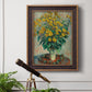 Impressionist floral painting of artichoke flowers by Claude Monet in an ornate bronzed mahogany wood frame displayed in a light-toned interior setting.