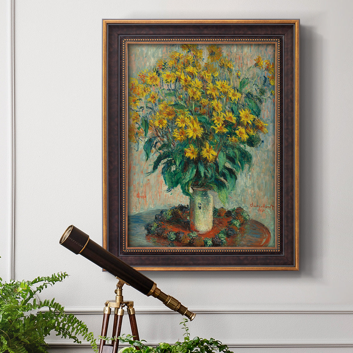 Impressionist floral painting of artichoke flowers by Claude Monet in an ornate bronzed mahogany wood frame displayed in a light-toned interior setting.