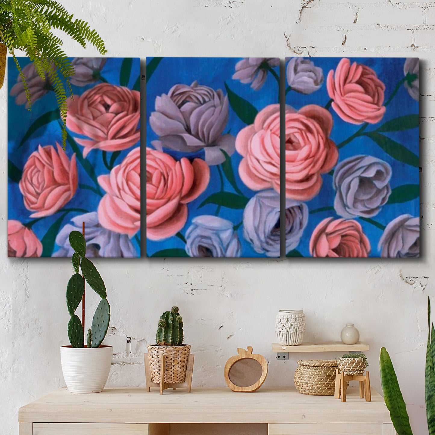Three-panel canvas wall art featuring layered botanical petal abstractions, displayed in a boho-chic entryway above a console table.