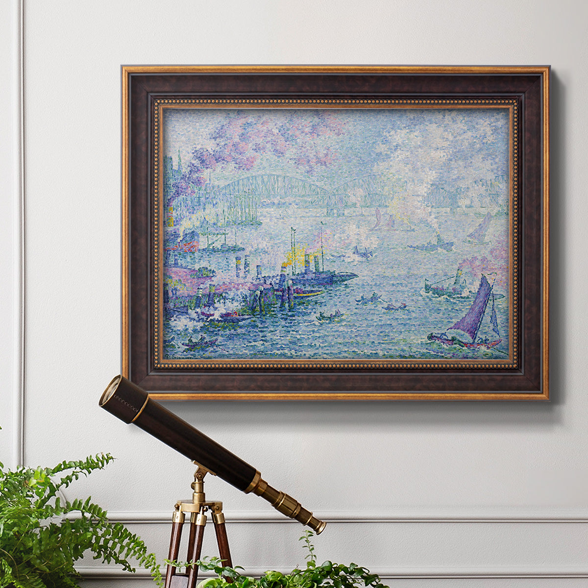 Impressionist industrial harbor scene by Paul Signac in an ornate bronzed mahogany wood frame displayed in a light-toned interior setting.