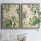 Set of two gray barnwood framed canvas prints depicting green rosettes, peach blossoms, and mosaic-like outlines arranged across two complementary compositions above a sofa in a bright living space.