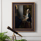 Quiet interior genre scene of a woman with scales by Johannes Vermeer in an ornate bronzed mahogany wood frame displayed in a light-toned interior setting.