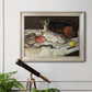 Impressionist still life painting of fish by Édouard Manet in an ornate champagne frame displayed in a light-toned interior setting.