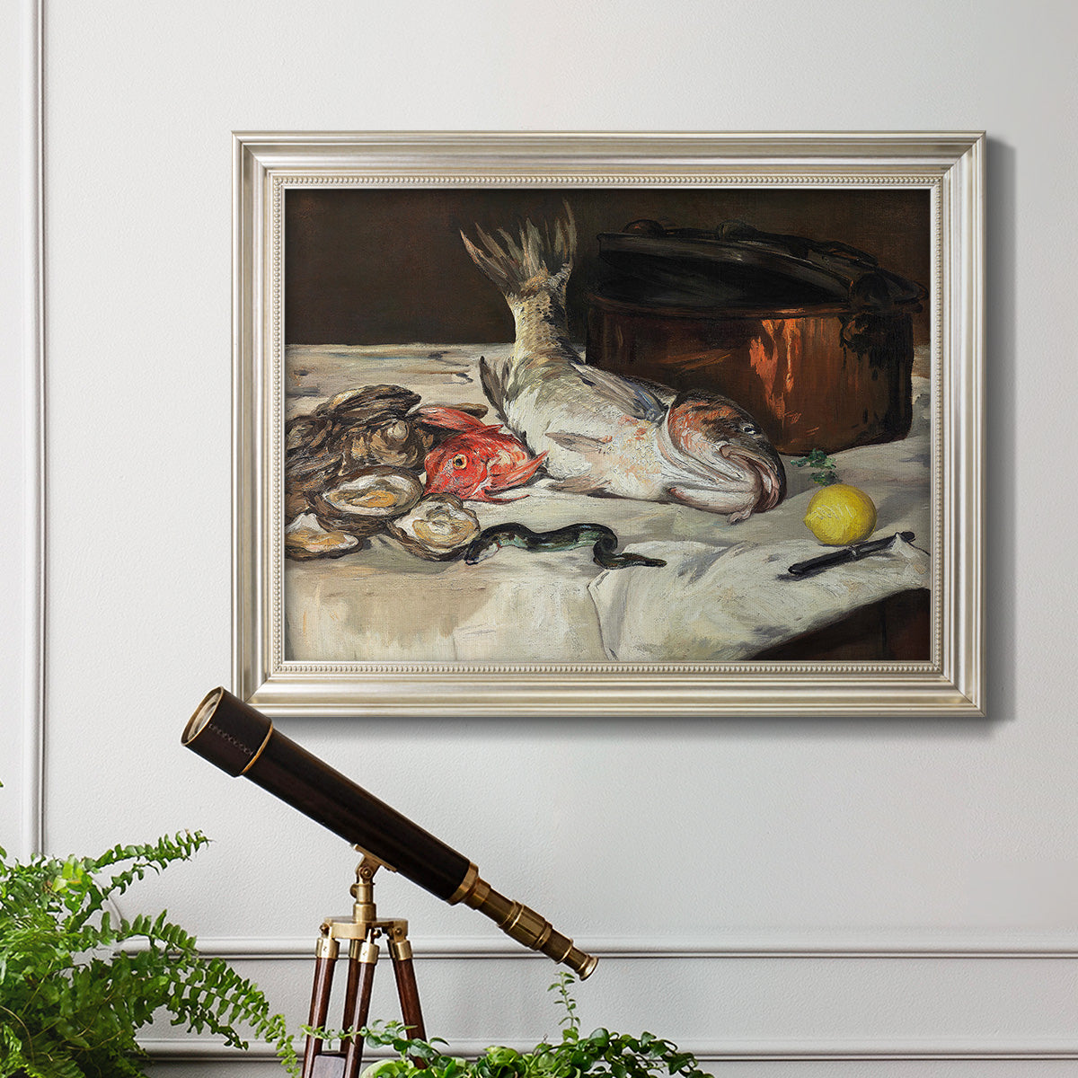 Impressionist still life painting of fish by Édouard Manet in an ornate champagne frame displayed in a light-toned interior setting.