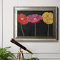 Contemporary poppy flower artwork in an ornate mottled silver frame displayed in a light-toned interior setting.