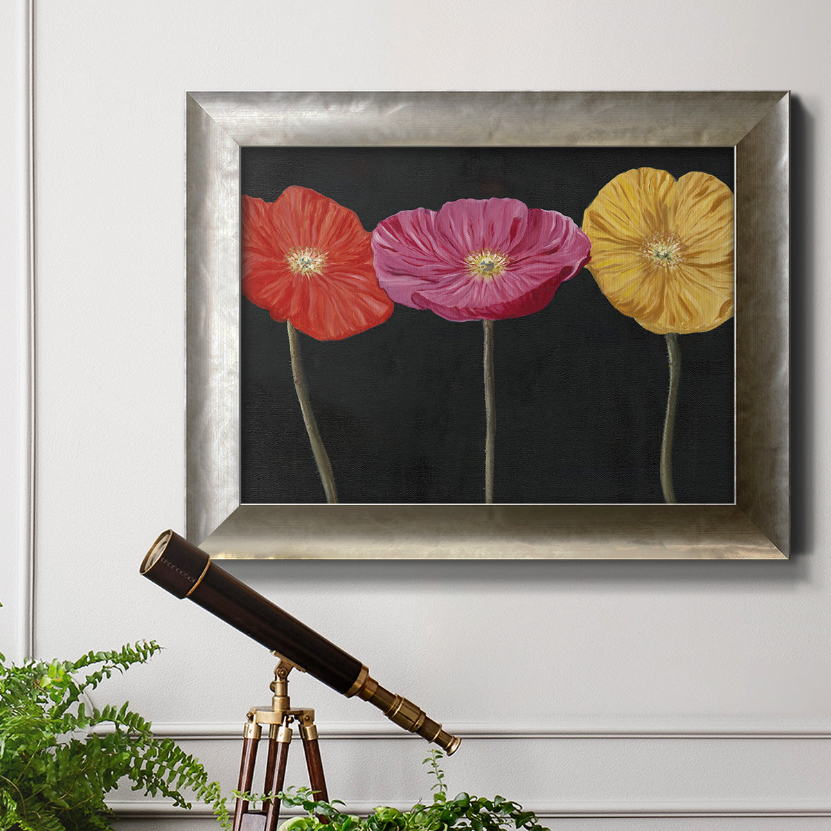 Contemporary poppy flower artwork in an ornate mottled silver frame displayed in a light-toned interior setting.