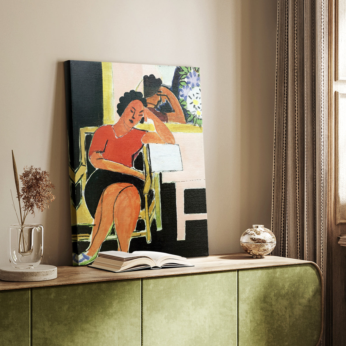 Canvas art print of a seated figure with a book in strong contrast and simple forms styled in a home decor setting.