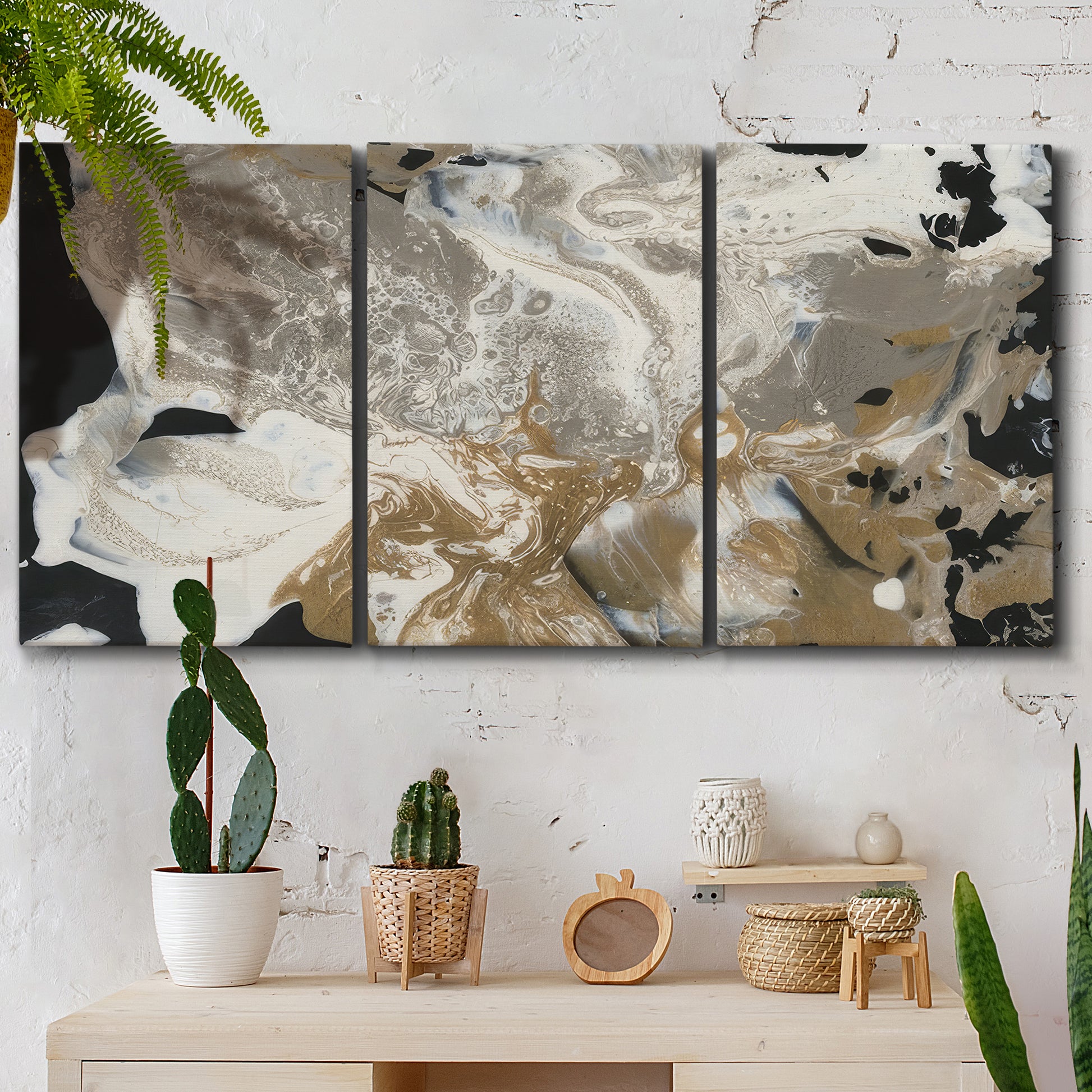 Three-panel canvas wall art featuring pale abstract mask like forms, displayed in a boho-chic entryway above a console table.