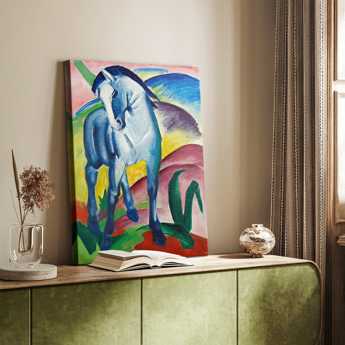 Canvas art print of a stylized animal figure in bold blue tones styled in a home decor setting.