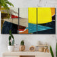 Three-panel canvas wall art featuring geometric mid century abstract blocks, displayed in a boho-chic entryway above a console table.