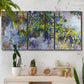 Three-panel canvas wall art featuring cascading purple wisteria blooms, displayed in a boho-chic entryway above a console table.