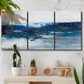 Three-panel canvas wall art featuring moody abstract sea with depth, displayed in a boho-chic entryway above a console table.
