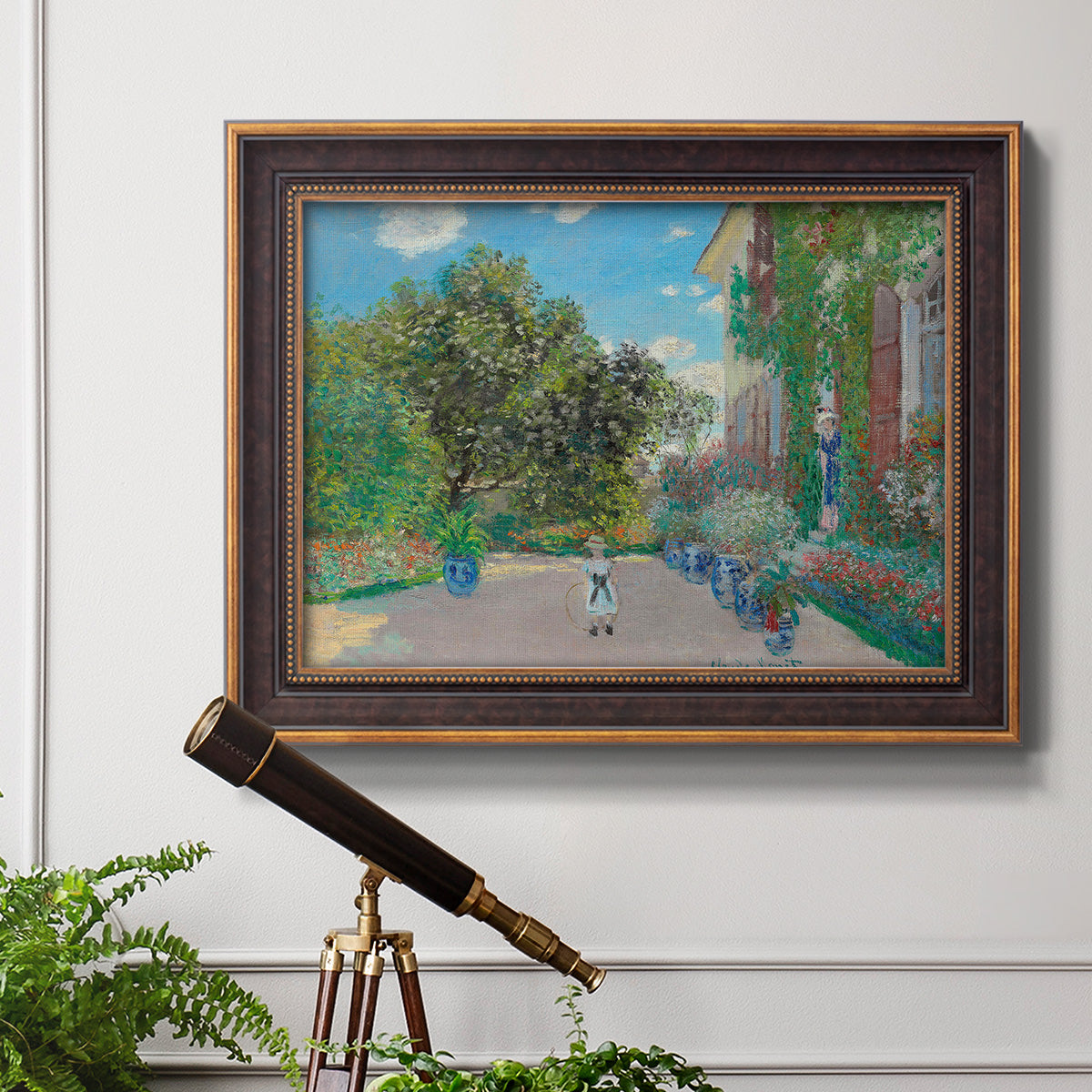 Impressionist residential landscape at Argenteuil by Claude Monet in an ornate bronzed mahogany wood frame displayed in a light-toned interior setting.