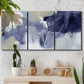 Three-panel canvas wall art featuring abstract sky break composition, displayed in a boho-chic entryway above a console table.