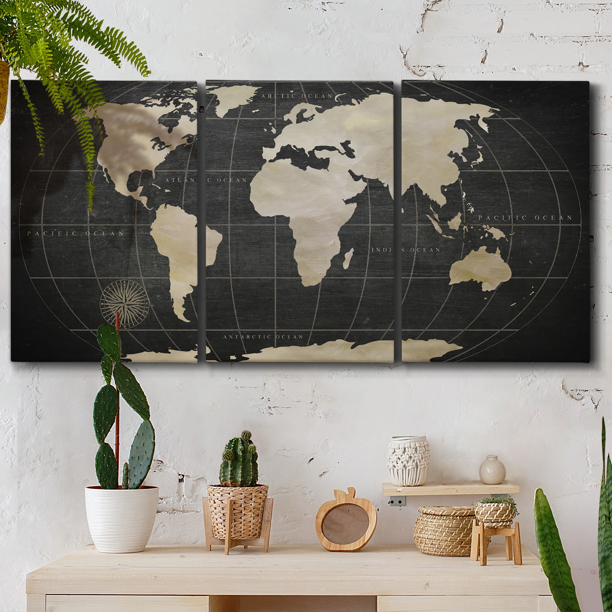 Three-panel canvas wall art featuring antique world map illustration, displayed in a boho-chic entryway above a console table.