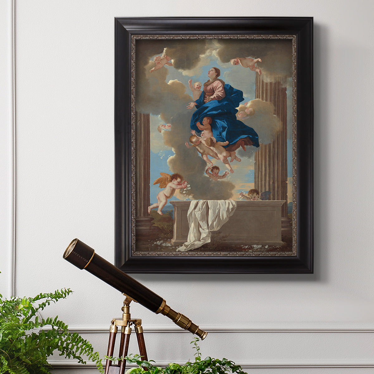 Classical religious depiction of the Assumption of the Virgin by Nicolas Poussin in an ornate black frame with gilded inner detail displayed in a light-toned interior setting.