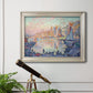 Impressionist Mediterranean harbor painting by Paul Signac in an ornate champagne frame displayed in a light-toned interior setting.