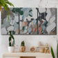 Three-panel canvas wall art featuring layered canyon inspired abstract forms, displayed in a boho-chic entryway above a console table.