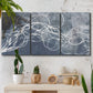 Three-panel canvas wall art featuring coastal shoreline at golden hour, displayed in a boho-chic entryway above a console table.