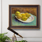 Impressionist still life with lemons by Vincent van Gogh in an ornate bronzed mahogany wood frame displayed in a light-toned interior setting.
