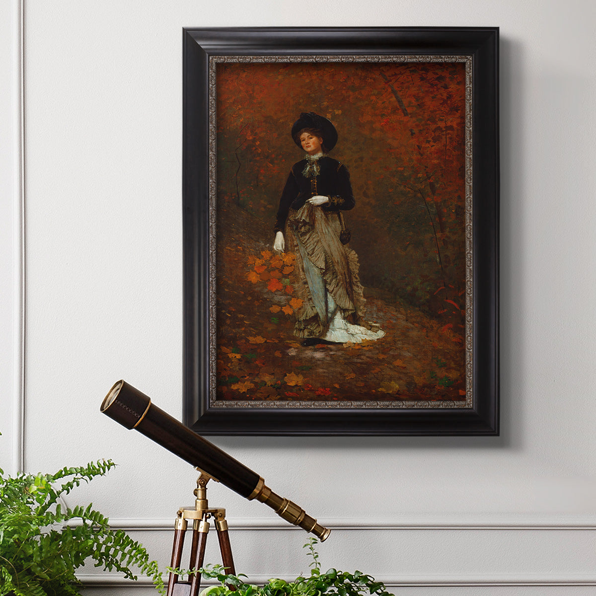 Realist autumn portrait scene by Winslow Homer in an ornate black frame with gilded inner detail displayed in a light-toned interior setting.