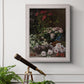 Early impressionist floral painting by Claude Monet in an ornate weathered white frame displayed in a light-toned interior setting.