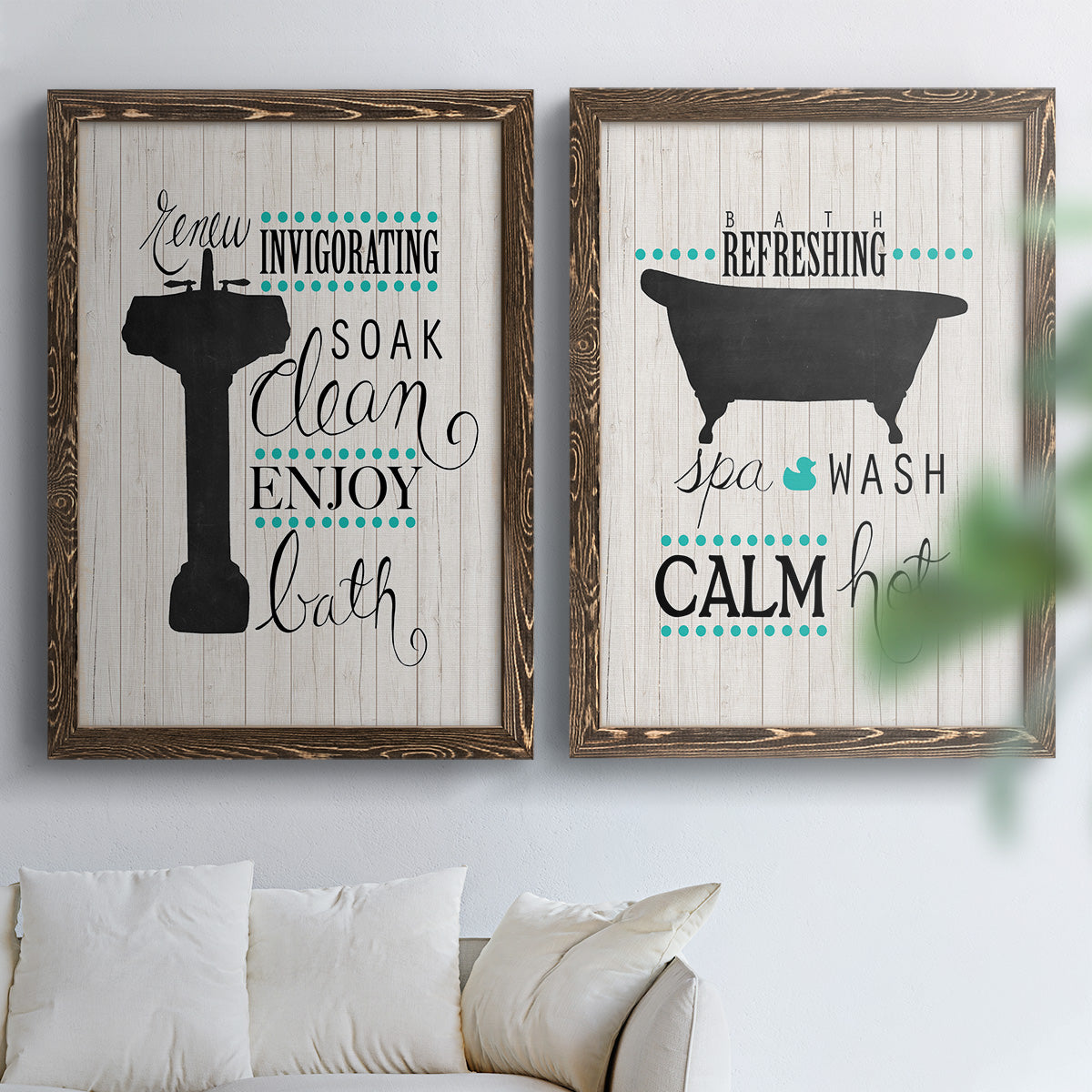 Set of two walnut barnwood framed canvas prints depicting black tubs, hand-lettered phrases, and small teal accents arranged across two complementary compositions above a sofa in a bright living space.