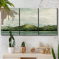 Three-panel canvas wall art featuring riverbank watercolor landscape, displayed in a boho-chic entryway above a console table.