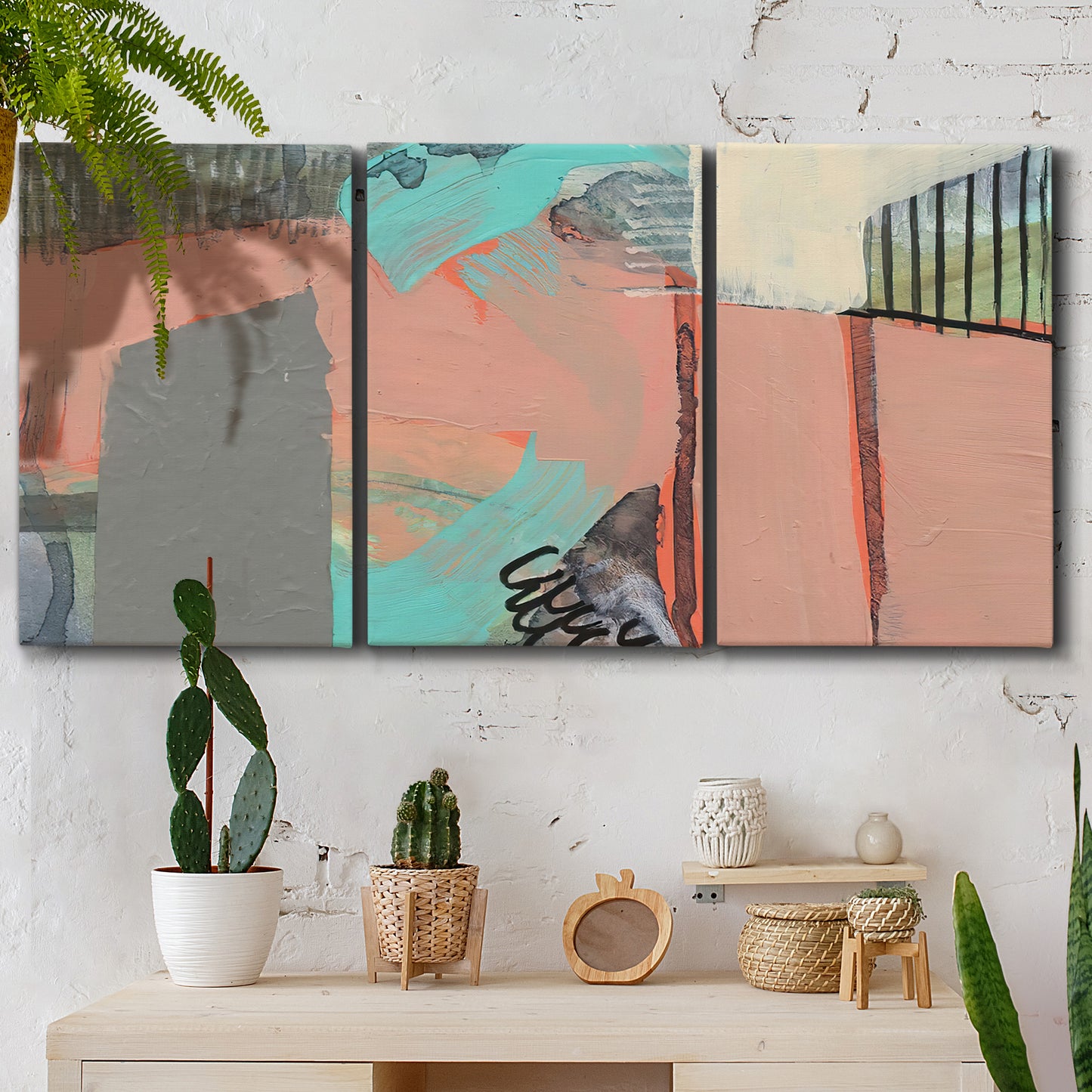 Three-panel canvas wall art featuring layered mid century abstract pathways, displayed in a boho-chic entryway above a console table.