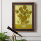 Impressionist sunflower still life painting by Vincent van Gogh in an ornate bronzed mahogany wood frame displayed in a light-toned interior setting.