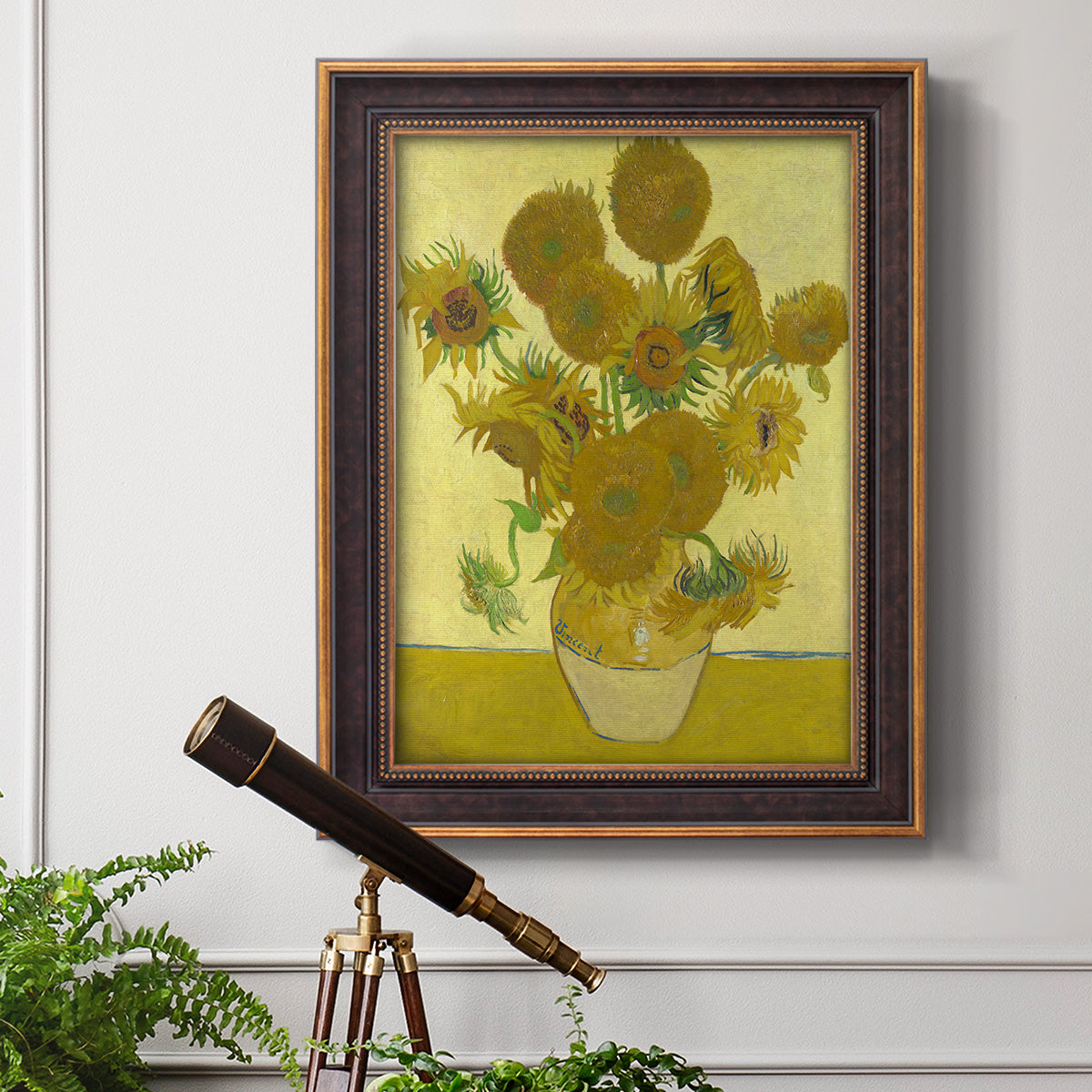 Impressionist sunflower still life painting by Vincent van Gogh in an ornate bronzed mahogany wood frame displayed in a light-toned interior setting.